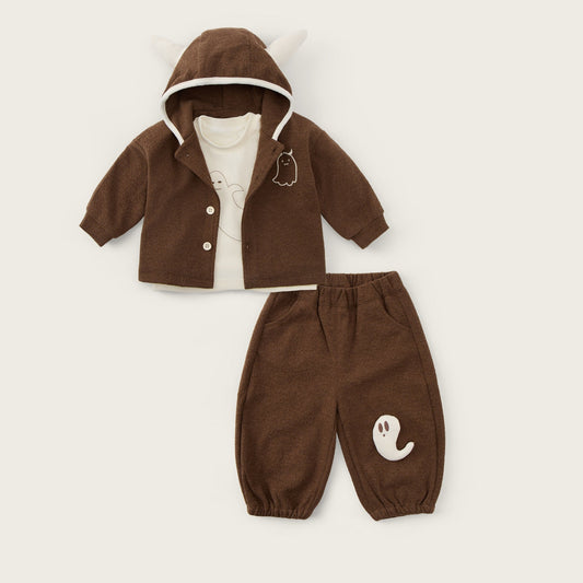 A baby clothing set displayed flat on a light beige background, featuring a brown hooded cardigan with white trim and a matching pair of brown pants with a white ghost graphic. The text 'jacinda bebe' is written at the top and 'lovely kids' at the bottom.