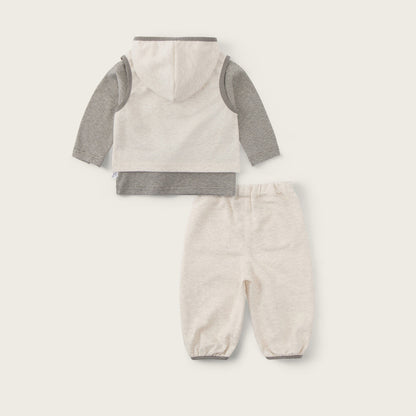 Baby two-piece outfit set featuring a hooded long-sleeve top and matching pants in a cream and heather gray colorway, displayed on a light beige background with 'jacinda bebe' and 'lovely kids' text.