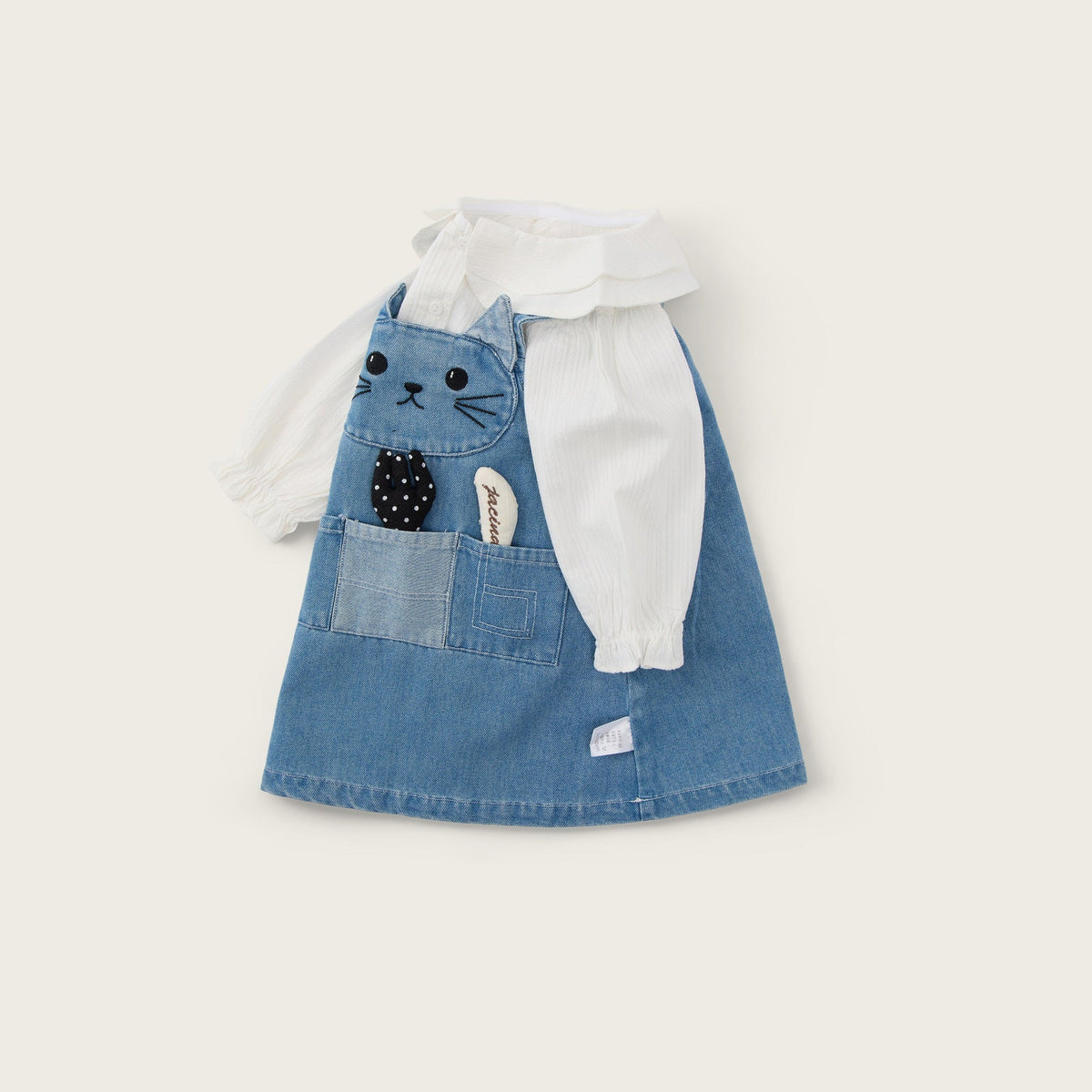 A silver-toned crescent-shaped ring featuring a row of white pearls and clear stones, photographed on a clean, light gray background.