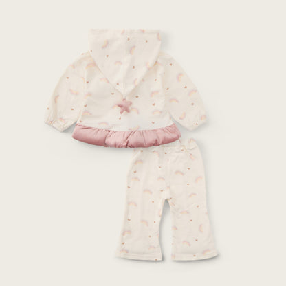 A baby girl's two-piece outfit set featuring a cream hooded top with a pink ruffle hem and matching cream pants, both printed with a subtle rainbow pattern. The set is displayed on a light beige background with 'jacinda bebe' at the top and 'lovely kids' at the bottom.