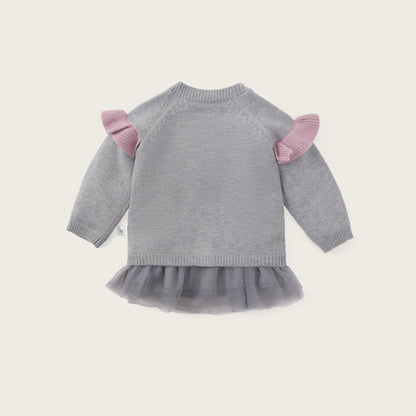 A baby girl's gray knit sweater with pink ruffle shoulder details and a gray tulle tutu hem, shown from the back on a light beige background with 'jacinda bebe' and 'lovely kids' text.