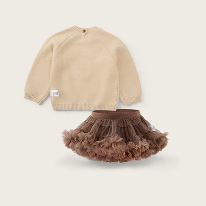 A baby clothing set featuring a beige knit long-sleeve top and a brown ruffled tutu skirt, displayed on a light beige background with the text 'jacinda bebe' at the top and 'lovely kids' at the bottom.