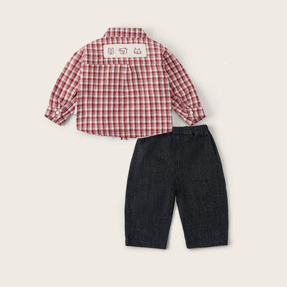 A baby clothing set featuring a red and white gingham long-sleeve shirt and dark denim shorts, displayed flat on a light beige background with 'jacinda bebe' and 'lovely kids' text.