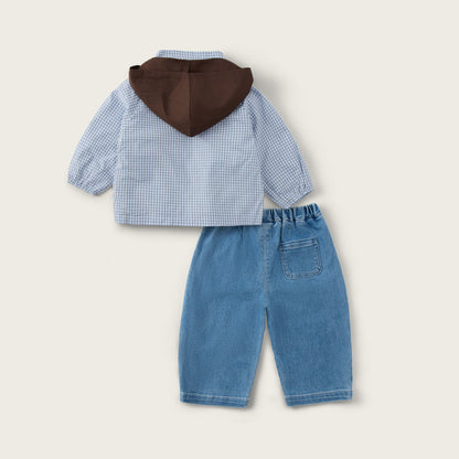 A baby boy's two-piece outfit set from Jacinda Bebe, featuring a light blue and white gingham long-sleeve shirt with a brown hood, paired with light blue denim pants, displayed on a warm beige background with brand text.